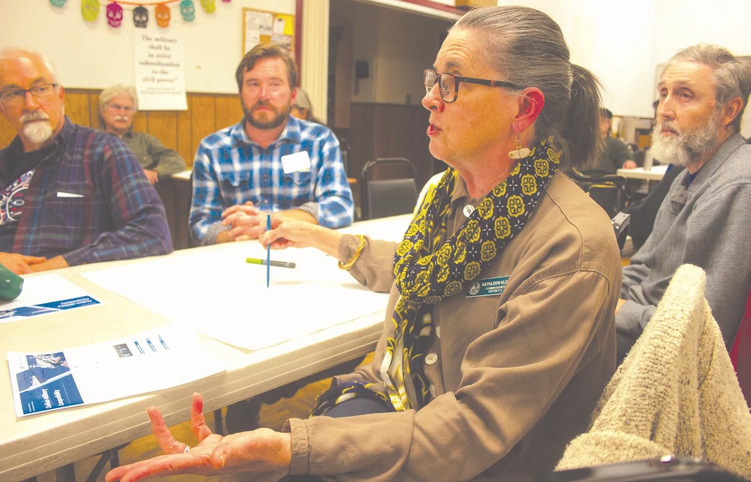 Jefferson County Commissioner Kathleen Kler expresses her concerns to representatives of the state Department of Commerce about the military's land use development rights over the county, during an Oct. 30 meeting to solicit public input at the Tri-Area Community Center.