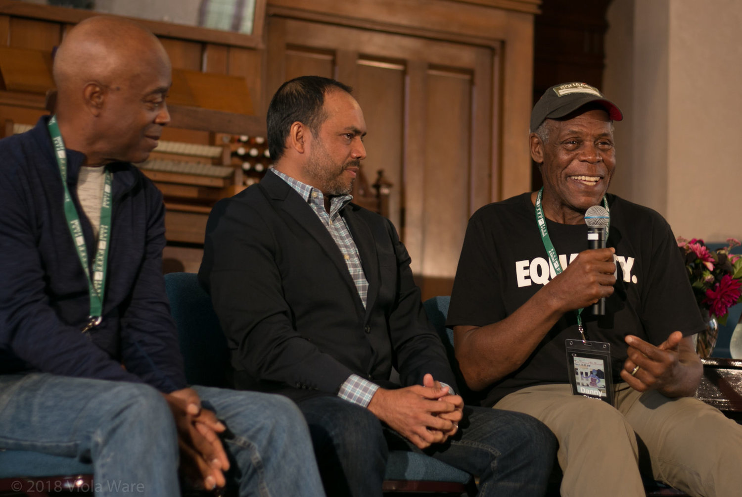 From left, filmmakers and change-makers Charles Burnett and Rais Bhuiyan listen to actor, activist and Port Townsend Film Festival’s special guest Danny Glover speak about his upbringing during a community conversation event. 
