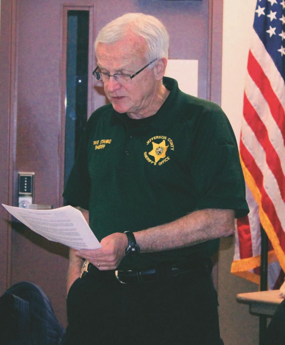 Jefferson County Sheriff Dave Stanko reads the Sheriff's Office Policy Manual's guidance on immigration violations to the Citizens Advisory Committee March 1.