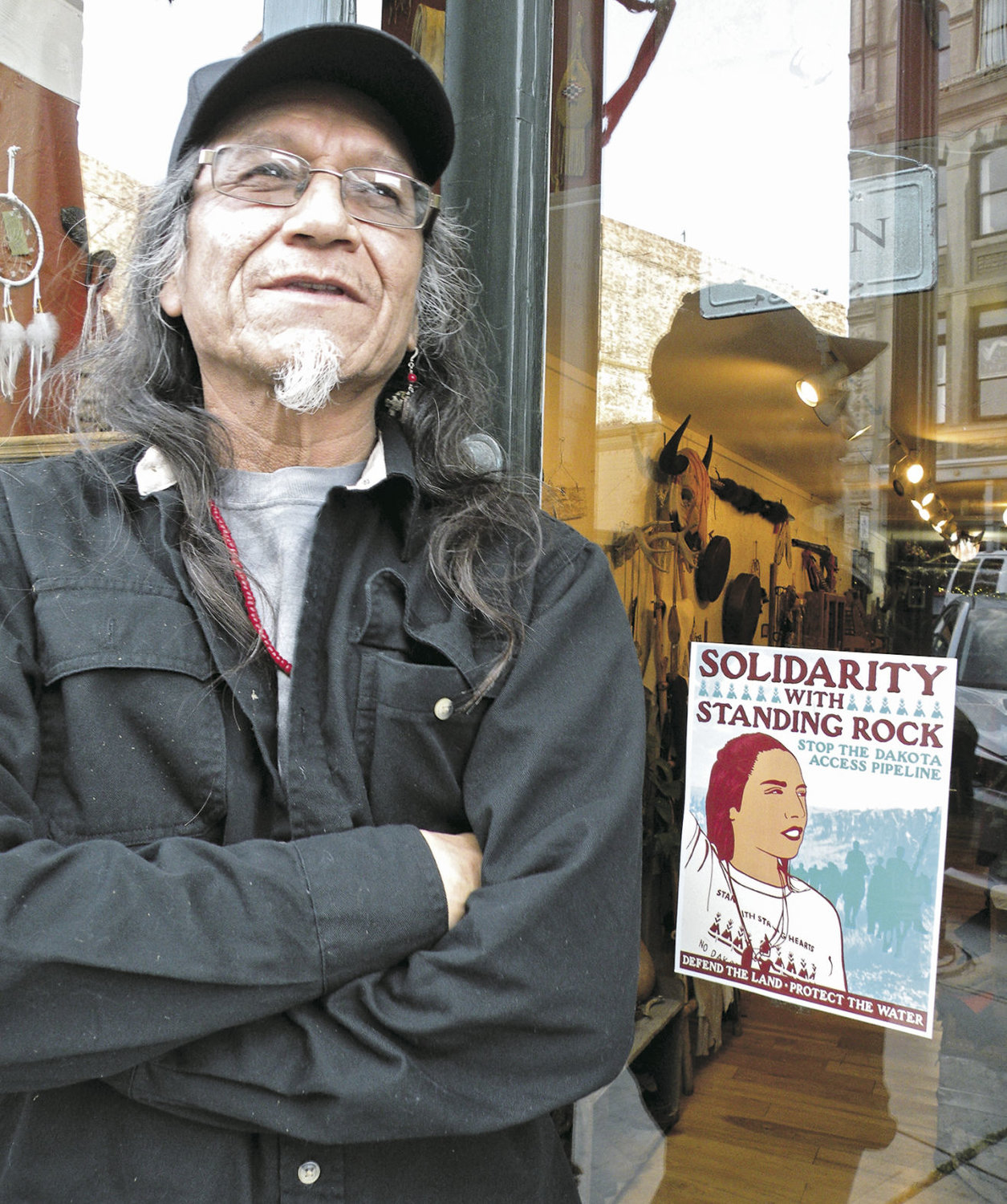 Gary Buckman of Big Wolf Trading Co. stands outside his shop on Taylor Street in downtown Port Townsend. He closed the shop for two weeks in October to be part of the Standing Rock gathering in North Dakota. Quimper Unitarian Universalist Fellowship helped him financially. If necessary, he said he and his wife, Hannah, would make the trip again. Photo by Allison Arthur