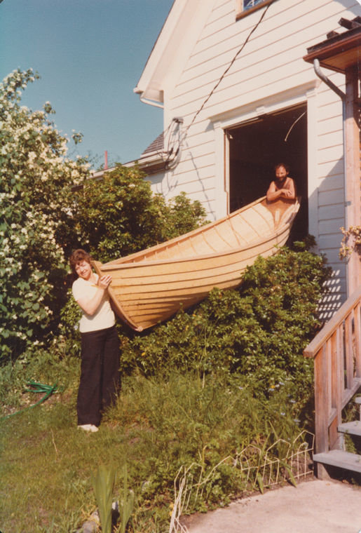 Mikki Mogseth (left) helps Dr. Bertram Levy slide his 14-foot wherry out of his house/office in Uptown Port Townsend. Mogseth was Levy's medical office secretary and nursing assistant. Levy debuted his boat at the 1978 Port Townsend Wooden Boat Festival. Photo courtesy Bertram Levy
