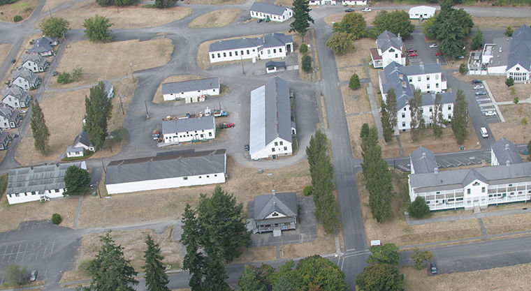 The Fort Worden Public Development Authority proposes to create the "Makers Square" complex, centered on Building 305 (center), the long, narrow building located behind the Guardhouse. To date, the PDA has raised $4 million to help with renovation of 10 underutilized buildings. 2012 Leader file photo by Patrick Sullivan, flight by Wyvern Air