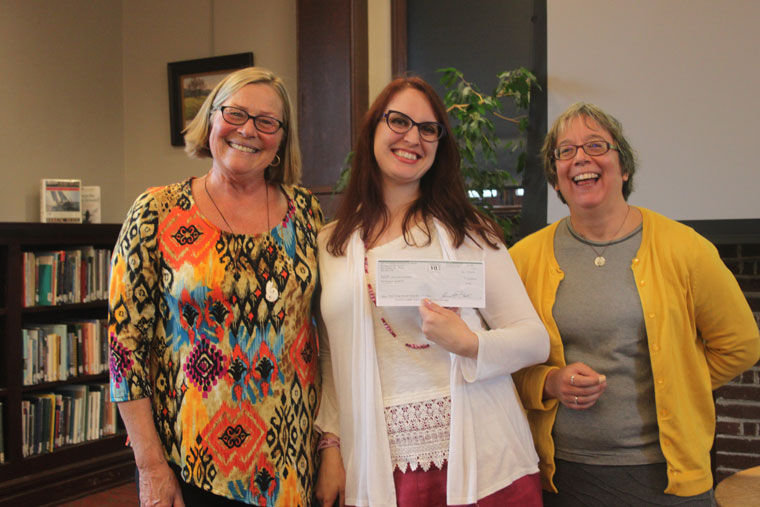 Janie Kimball (left) of the Better Living Through Giving Circle presents a $10,000 check to Port Townsend Public Library director Melody Sky Eisler and youth services librarian Kit Ward-Crixell on behalf of the Jefferson County Community Foundation's Better Living Through Giving Circle. Photo by Robin Dudley