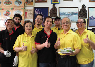 1-2-3 Thai Food employees (from left) Manne Kaylor, Alex Picard, Jenny Chenruk, owner Eddie Chenruk, Charlie Chenruk, Pitt S., Chuck Chenruk and Christa Hall take a moment from a busy day at the popular thai restaurant. The business is run by the Chenruk family and they say they feel their customers are part of that large extended family. Photo by Allison Arthur