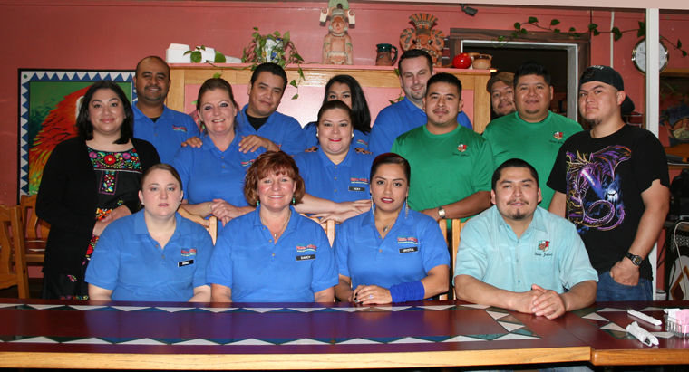 Fiesta Jalisco employees (back to front, from left) Jose, manager Cesar, Aaliyah, Jarred, Core, owner Elena, Michelle, Vicky, Alex, Raul, Tarsis, Ranee, Darcy, Crystal, Oscar (Head Chef) gather inside the popular Port Hadlock family Mexican restaurant. Photo by Jen Clark