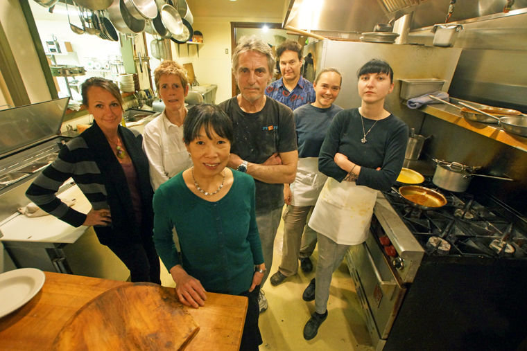 Hillbottom Pie owners Mariko Willenhag and Tim Roth, center, are surrounded by (from left) Michele Mailloux-Zabransky, Julie Lee, Nick Alexander, Cristi Christensen and Sadie Maher in the kitchen of their downtown Port Townsend restaurant. Photo by Nicholas Johnson