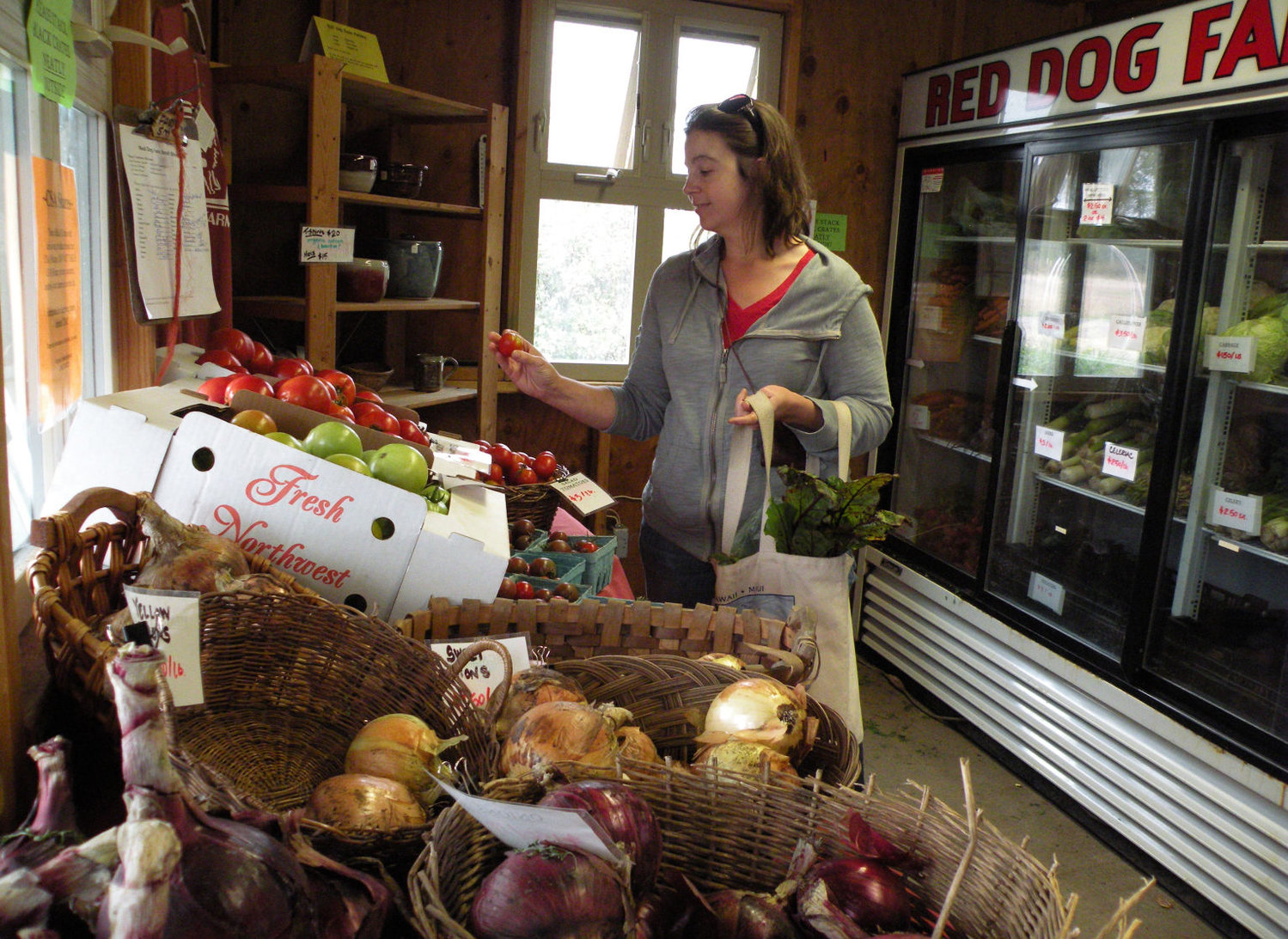 Pam Robbins of Chimacum stopped by Red Dog Farm Sept. 13 for a few fresh vegetables, as she does often. Red Dog's farm stand, at 406 Center Road, was recently written up in Rodale's "Organic Life" magazine as one of the top 50 farm stands in the United States. Photo by Allison Arthur