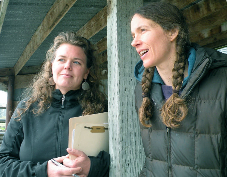 Kate Dean (left) and Crystie Kisler, Finnriver Farm &amp; Cidery co-owner, share a vision for the future of farming in the Chimacum Valley: to make agriculture endeavors like the new Finnriver Orchard sustainable. The debut of FarmHouse Offices and CoLab, at the crossroads in Chimacum, is set for May 20. Photo by Allison Arthur