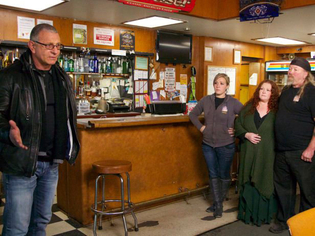 Chef Robert Irvine (left), host of the Food Network's "Restaurant Impossible" Reality TV show, in a scene from his visit Nov. 16, 2014 to Zoogs Caveman Cookin in Port Hadlock, with staff Holly Pritchett, Michelle Forsberg and Bret "Zoog" Forsberg. This is the restaurant's bar, before the remodel. Photo courtesy of Food Network