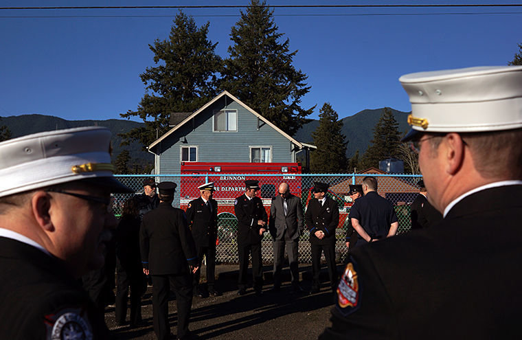 Fire and law enforcement personnel wait in the parking lot prior to a memorial service for Robert "Moe" Moser Saturday, Feb. 21 at Quilcene School. Photo by Nicholas Johnson