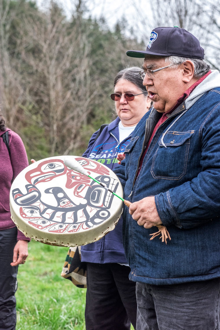 Gene Jones, spiritual leader for several local S’Klallam tribes, and Marilyn Jones of the Suquamish Tribe opened the ceremonies of the 10th annual Plant-A-Thon on Feb. 14 with intertribal Chief Dan George’s traditional Suquamish prayer song. Photo by Charles Espey
