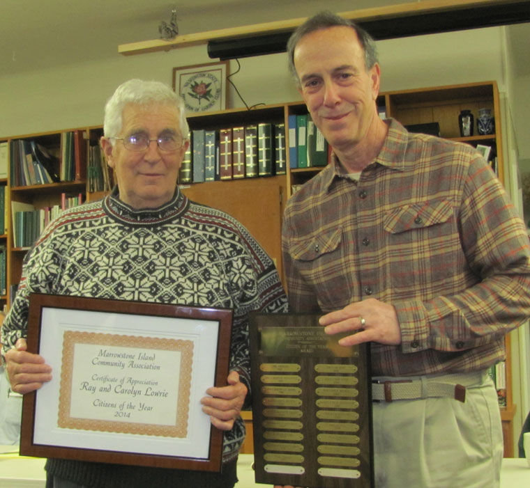 Ray Lowrie accepts the Citizen of the Year award from Marrowstone Island Community Association President Ken Collins at a ceremony Monday, January 19.