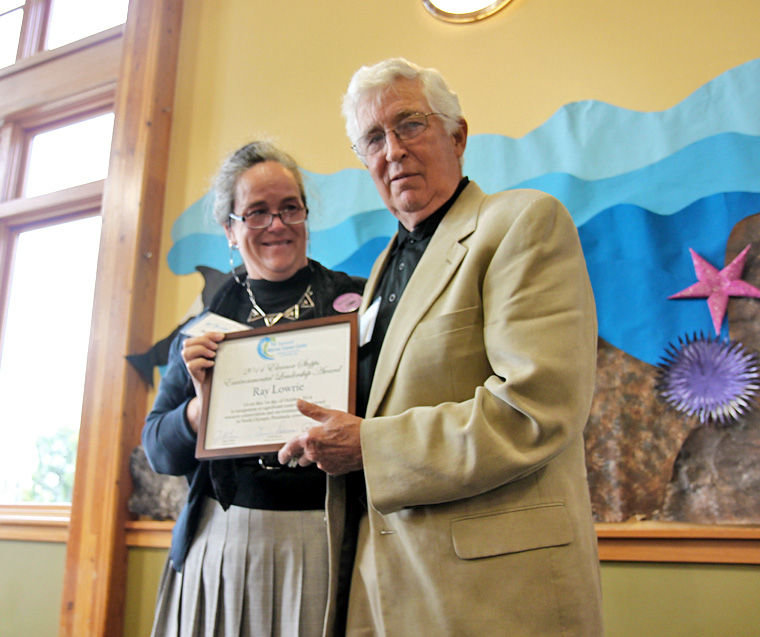 Janine Boire presented Ray Lowrie with the 10th annual Eleanor Stopps Environmental Leadership Award on Oct. 1. Photo by Robin Dudley