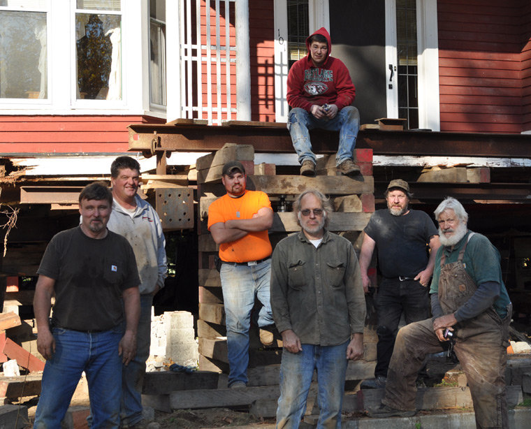 These men volunteered their considerable pool of expertise for the Quilcene Historical Museum's latest stage of the ongoing Worthington Park project – moving a Victorian home for a foundation rebuild. Pictured are (from left) John Kunkel of Seattle, Greg Hudson of Sequim, Chris Johnson of Marysville, Quilcene's Jeff Monroe as project leader, Travis Reeve of Quilcene (seated), Lester Vilnes of Everett, and James Dent of Pacific. Photo by Viviann Kuehl