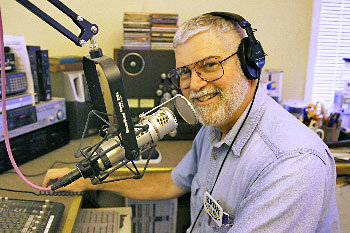 Joe Mann, general manager of KROH-FM 91.1, operates Port Townsend’s new Christian radio station from an apartment on Franklin Street. He said the station, owned by the Seventh-day Adventist Church, is eager to feature messages from local churches of other Christian denominations. Photo by Nicholas Johnson