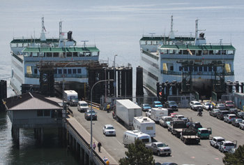 The ferry MV Chetzemoka (left) is joined in revenue service by sister ship Salish (right) with the noon sailing Friday, July 1 from Port Townsend, Washington State Ferries announced June 28. The Fourth of July weekend is the year's heaviest ferry travel weekend. Also new on this route, double toll booths are to be used. File photo by Patrick J. Sullivan
