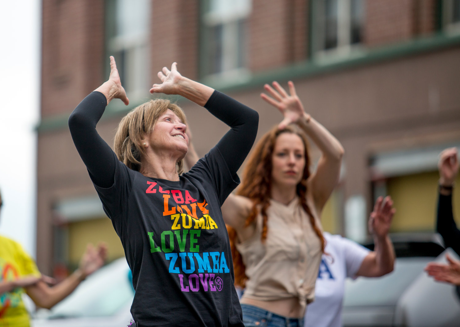 Susan Rucker dances along with students, friends, and fellow instructors during the June 26 flash mob.