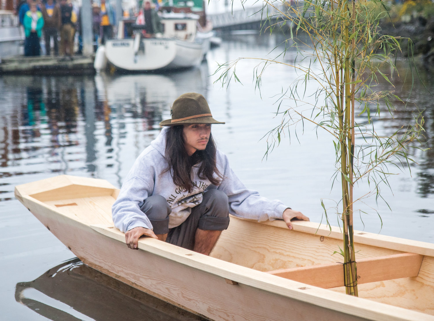 Gabriel Partridge, a student at the Northwest School of Wooden Boat Building in Port Hadlock, sits in the Japanese river boat he helped build with a class of nine fellow students.