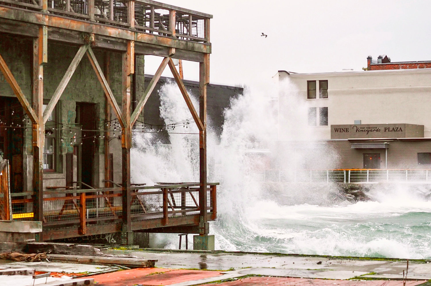 In this photo, captured by freelance maritime journalist Dieter Loibner on the morning of Jan. 29 during an 8.9-foot high tide, under a low-pressure system and with south winds whipping the crests, the waters of Port Townsend Bay are seen crashing against the sea-facing foundations of Water Street.