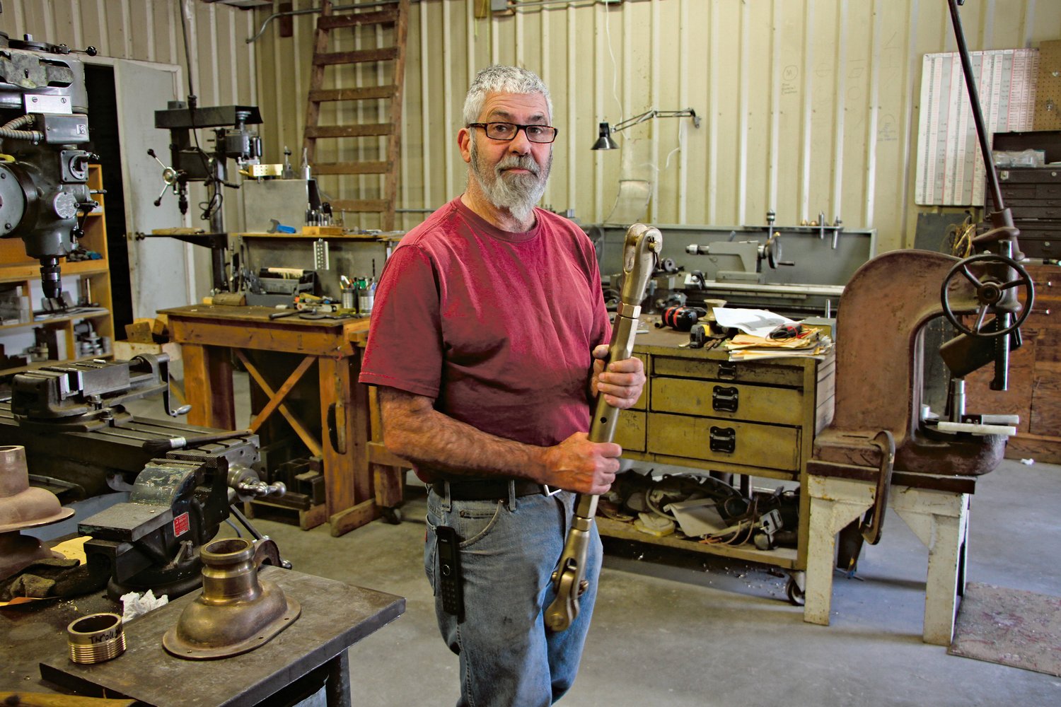 Pete Langley, owner of the Port Townsend Foundry holds a bronze turnbuckle cast at the foundry