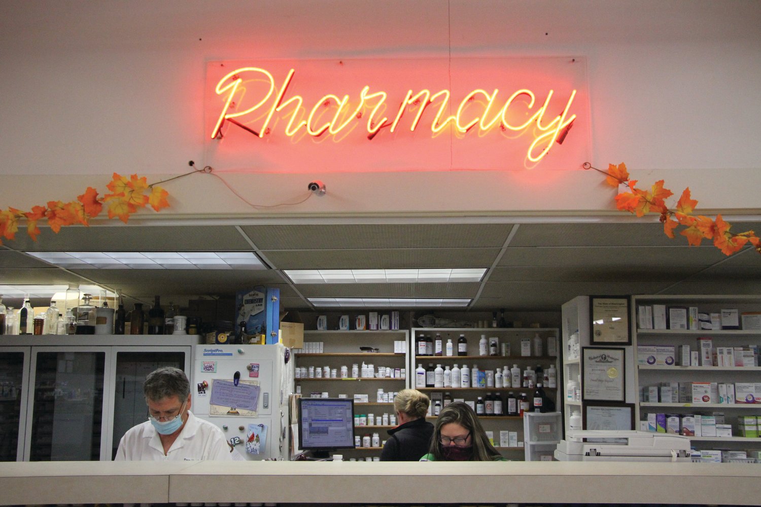 Pharmacist Don Hoglund works behind the counter at his pharmacy, Don’s Pharmacy. Hoglund recently announced that he plans to sell the business, but will remain on staff.