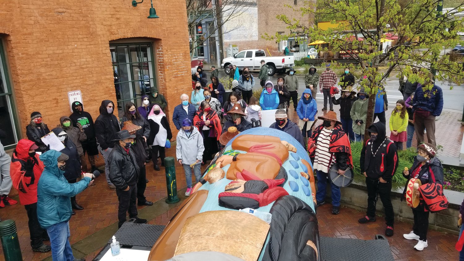 The crowd gathers for a blessing ceremony for the House of Tears carvers' newest totem pole. Members of the Port Gamble S'Klallam Tribe sang traditional songs in honor of the occasion.