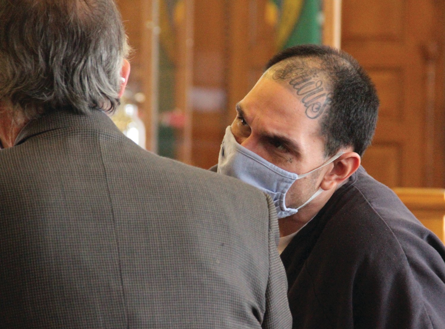 Che Jonathan Salazar talks with attorney Richard Davies during an earlier appearance in Jefferson County Superior Court.