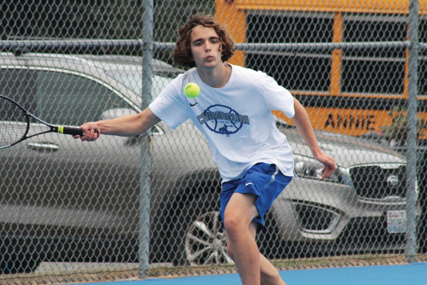 Ben Martin of the East Jefferson Rivals returns a serve during his winning outing against Annie Wright’s Hugo Ban in boys varsity tennis.