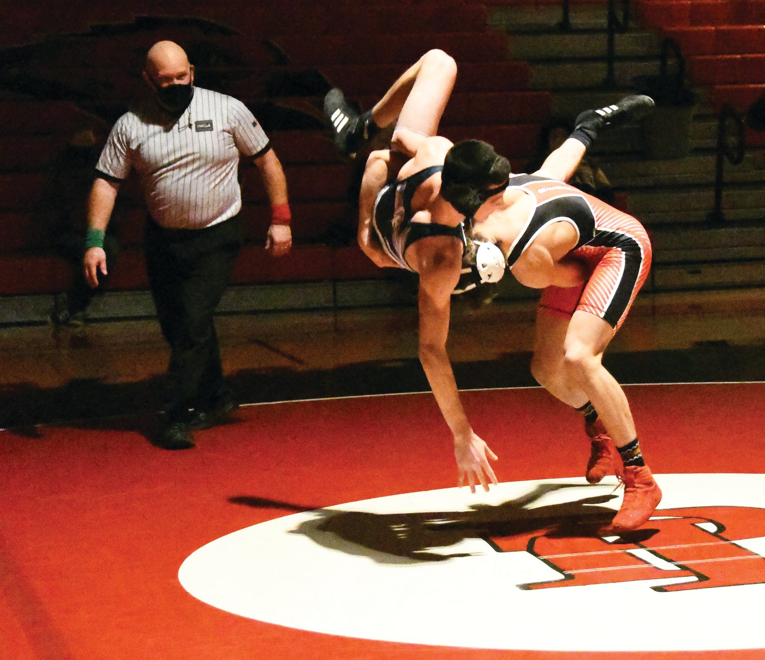 Logan Massie slams his opponent to the mat in the first period. Massie later won the match by fall.