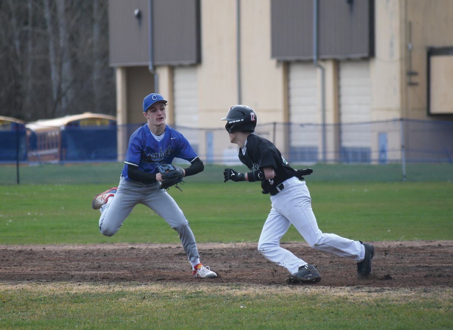 Rivals second baseman Brody Moore tags out a Klahowya runner.