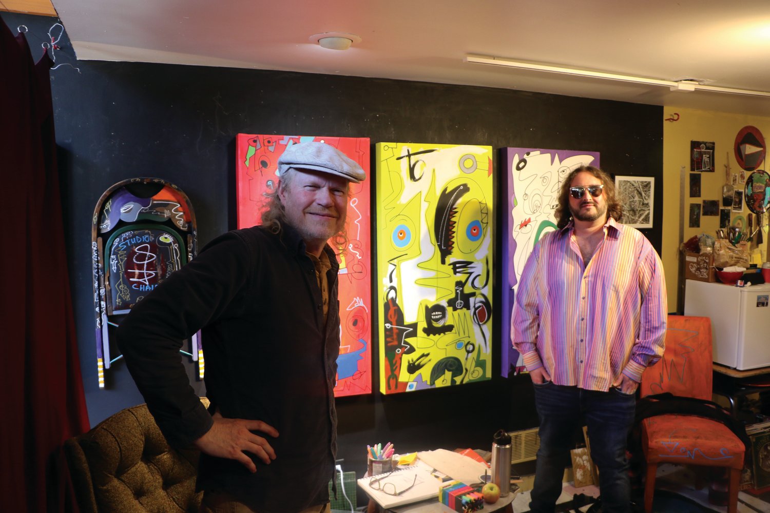 Painter Milo Redwood with his friend and art manager, B. Barclay, in Redwood’s Water Street studio.