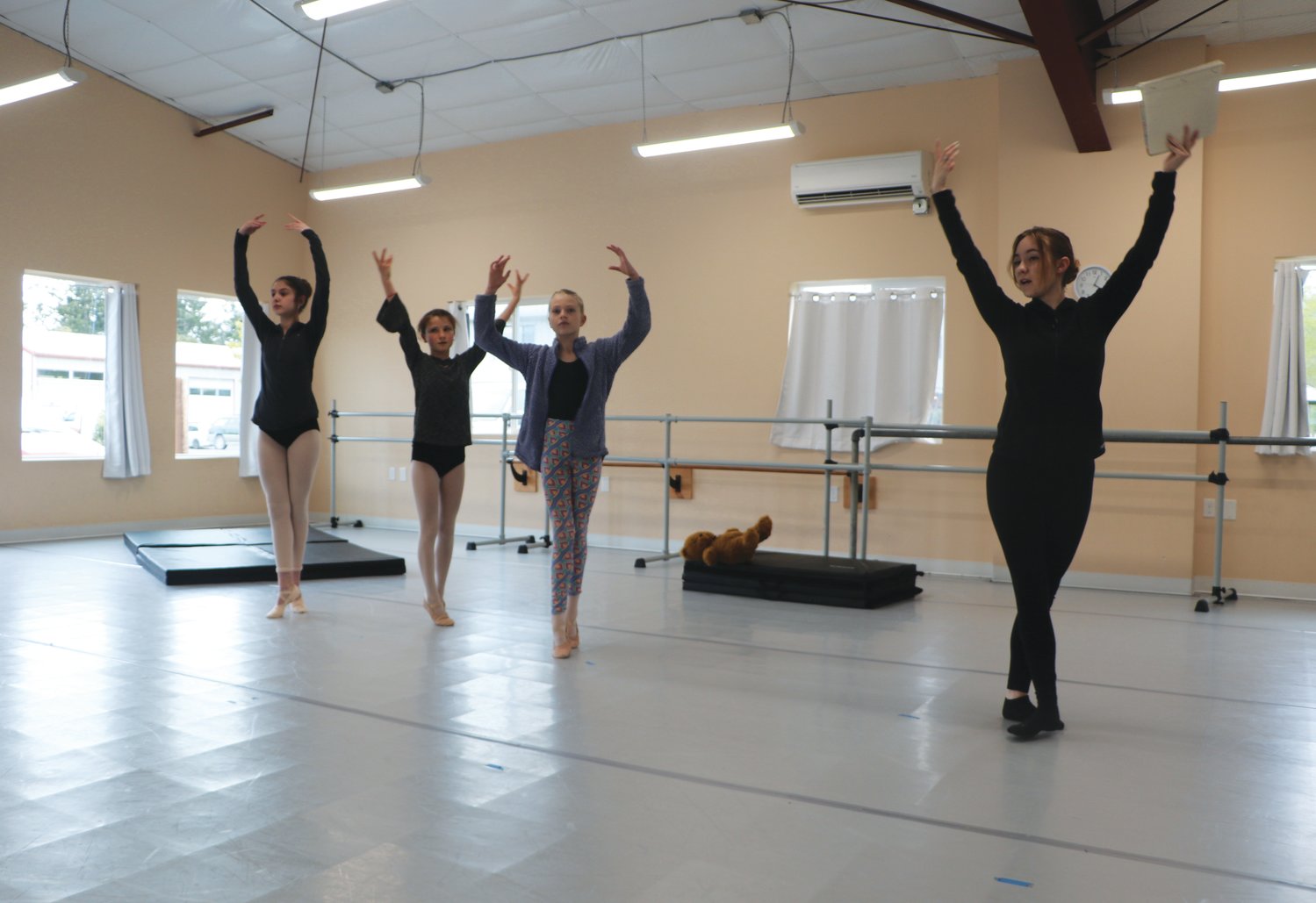 From Left: Cadence Hartland, 15, Molly Yanoff-Odell, 11, Cricket Douglas, 11, and Instructor Anna Tallarico in rehearsal for their spring performance of “Peter Pan.”