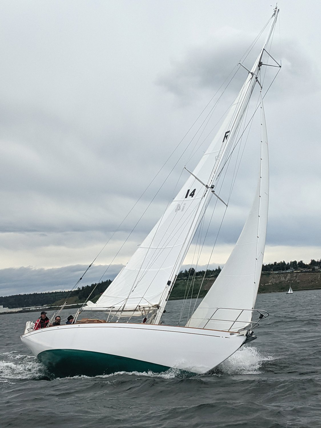A sailboat tilts landward as the crew navigates Port Townsend Bay during Saturday’s race.
