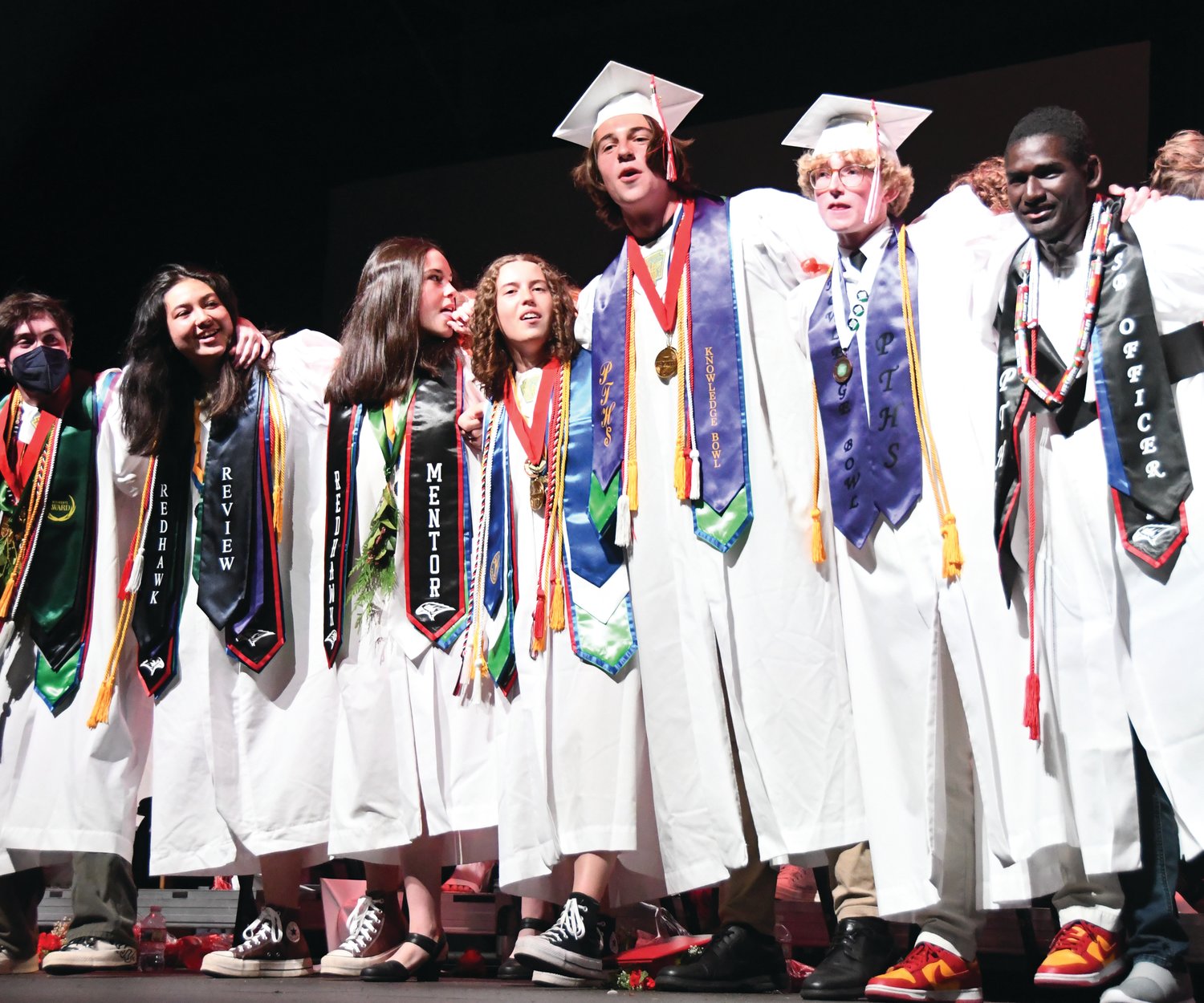 Port Townsend High School graduates sing and sway to their alma mater at the end of Friday’s ceremony.