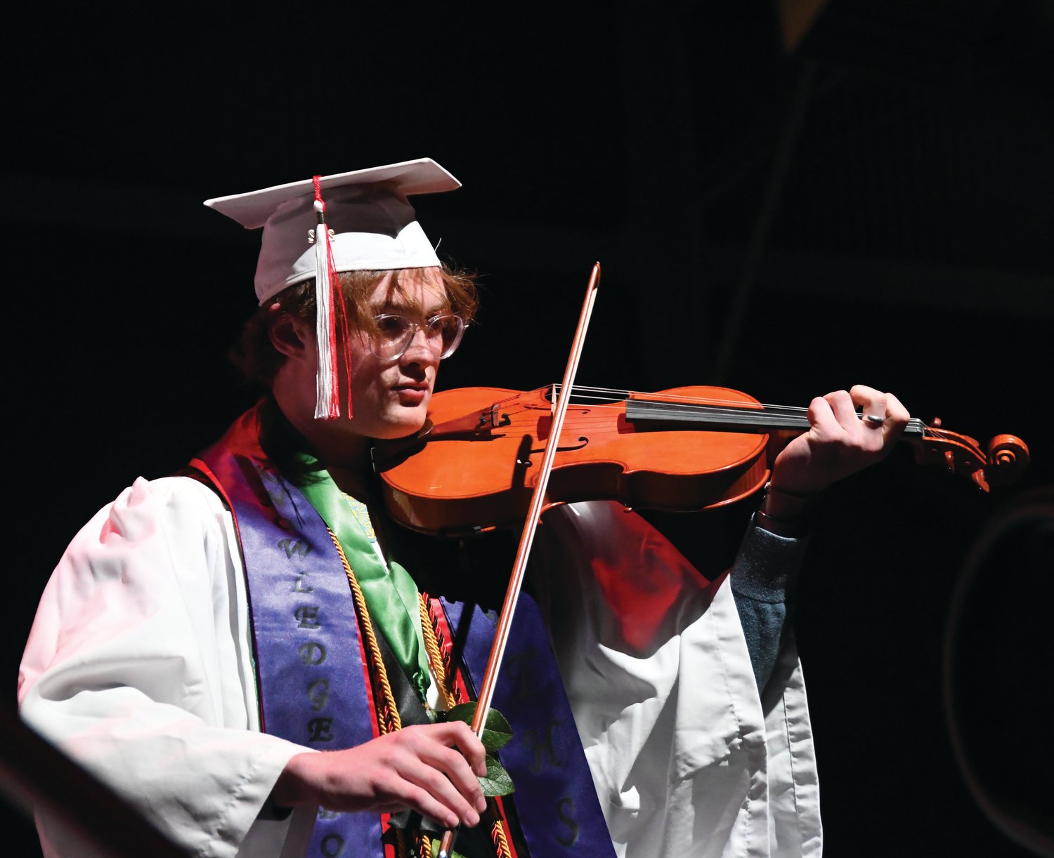 Senior violin soloist Tusker Behrenfeld performs  “Appalachian Waltz” to the audience.