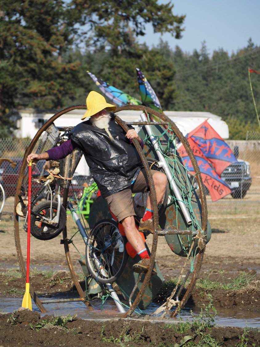 Peter Wagner climbs his World’s Largest Bitcoin to power it through the depths of the “Dismal Bog” at the fairgrounds.