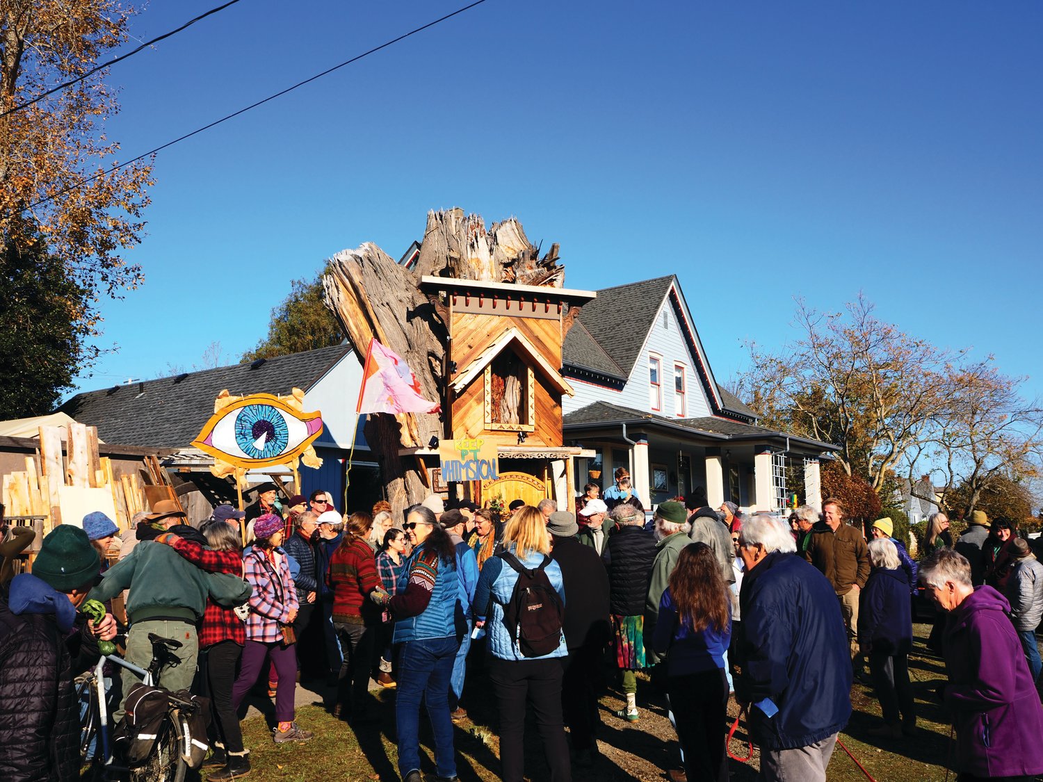 A crowd of almost 100 people gathered around the Raccoon Lodge on Saturday, Nov. 12 to both celebrate the work and voice their support of it staying in place.