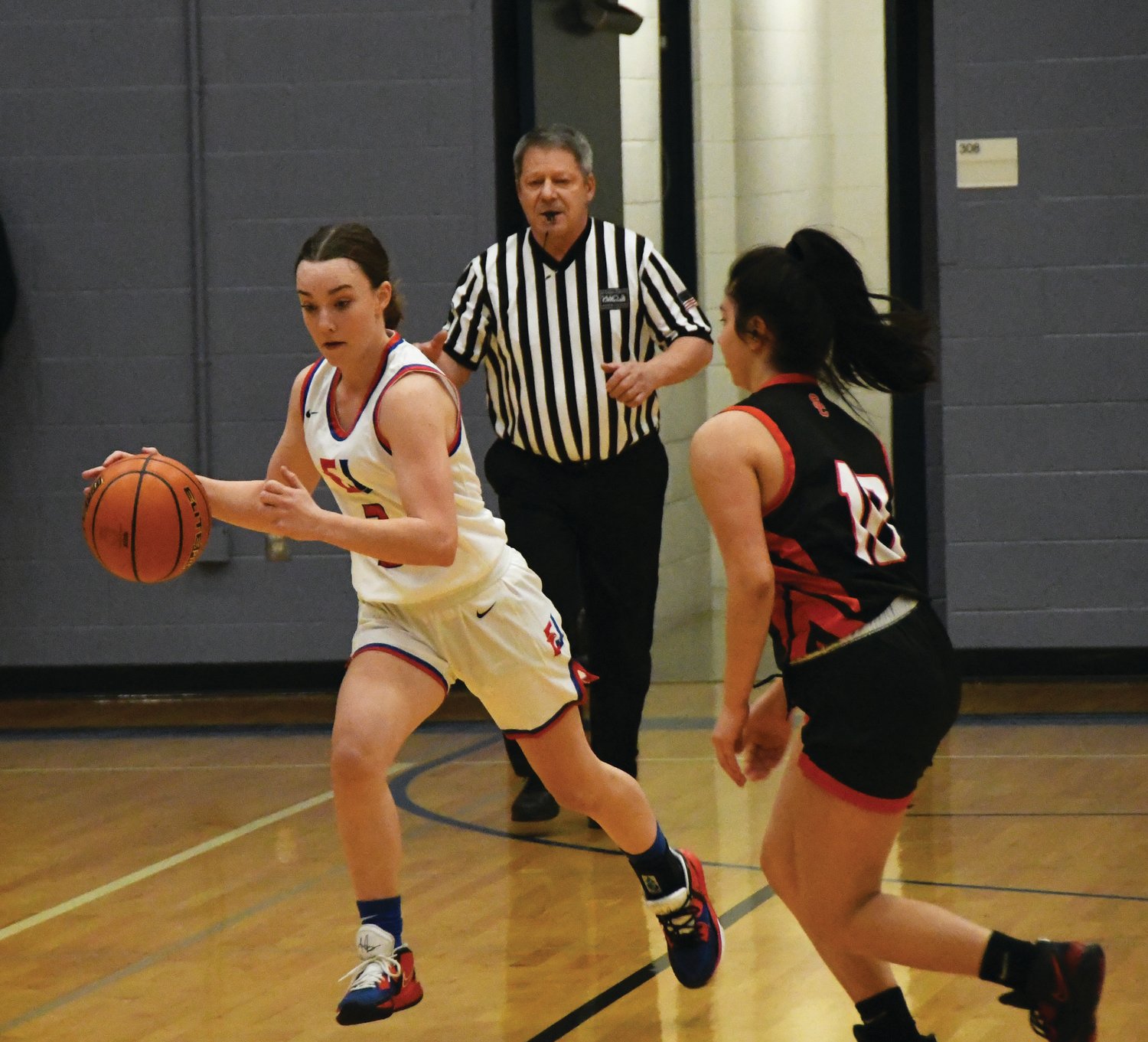 Sophomore guard Kay Botkin dashes up the court, looking to feed the ball to her teammates. Botkin lead her squad in scoring, with 10 points and three assists.