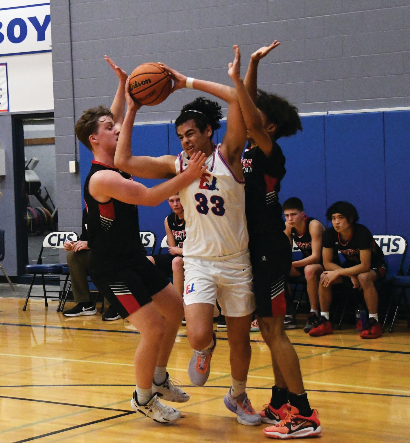 Rivals forward Keidan Guzman fights through a double team to get to the paint.