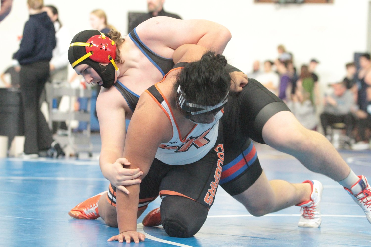 Rivals senior and heavyweight Beau Manuel maneuvers around the top of his foe during the Bainbridge-based tournament over the weekend.