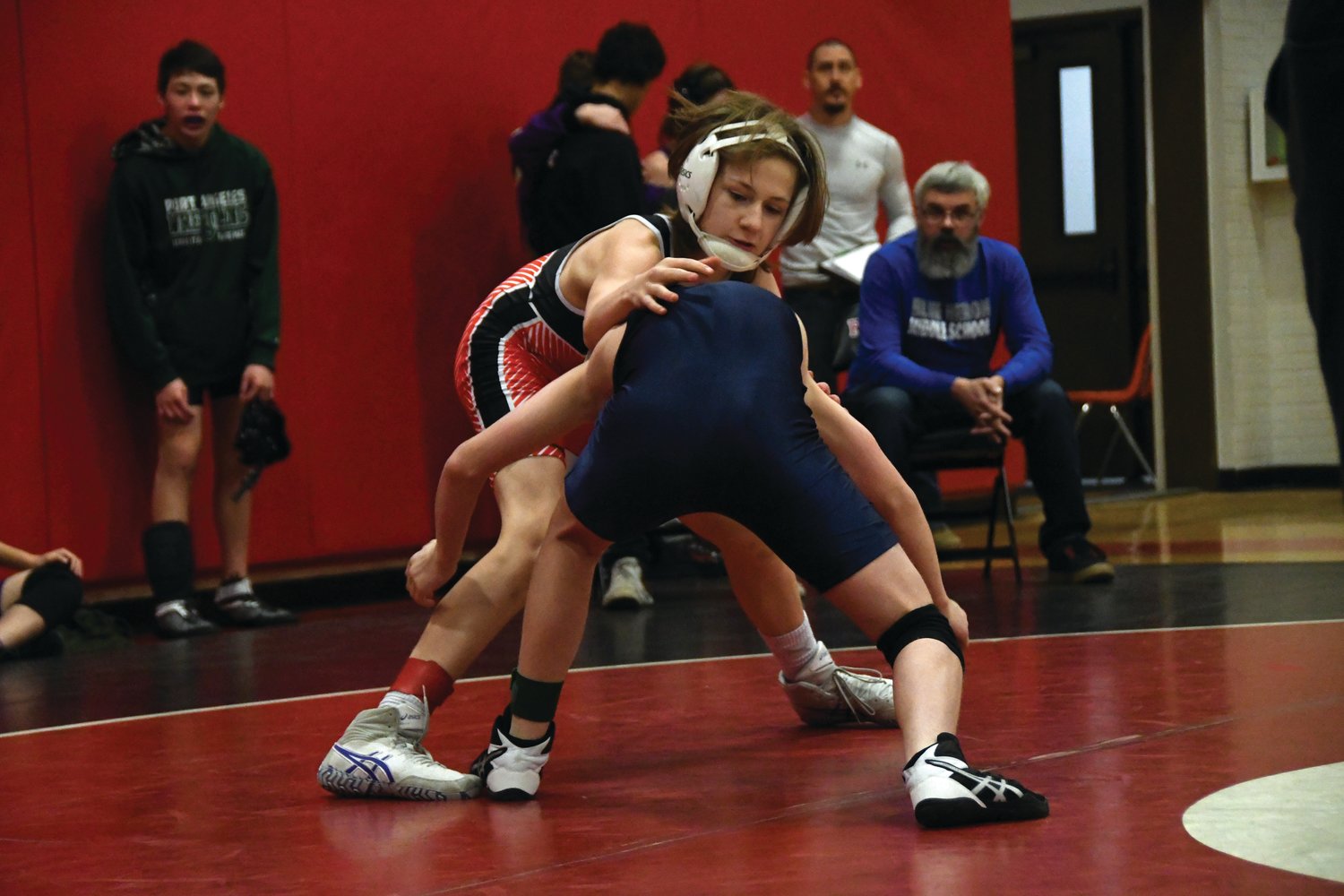 Chimacum eighth-grader Caleb Johnson tangles with his opponent as he looks for the takedown.