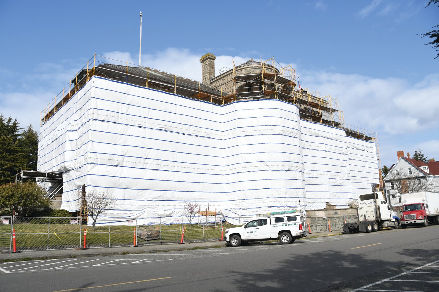 The Port Townsend Post Office is currently surrounded by 
construction tarps and scaffolding as construction continues to repair, remove, and renovate windows and other features of the historic building, built in 1893.