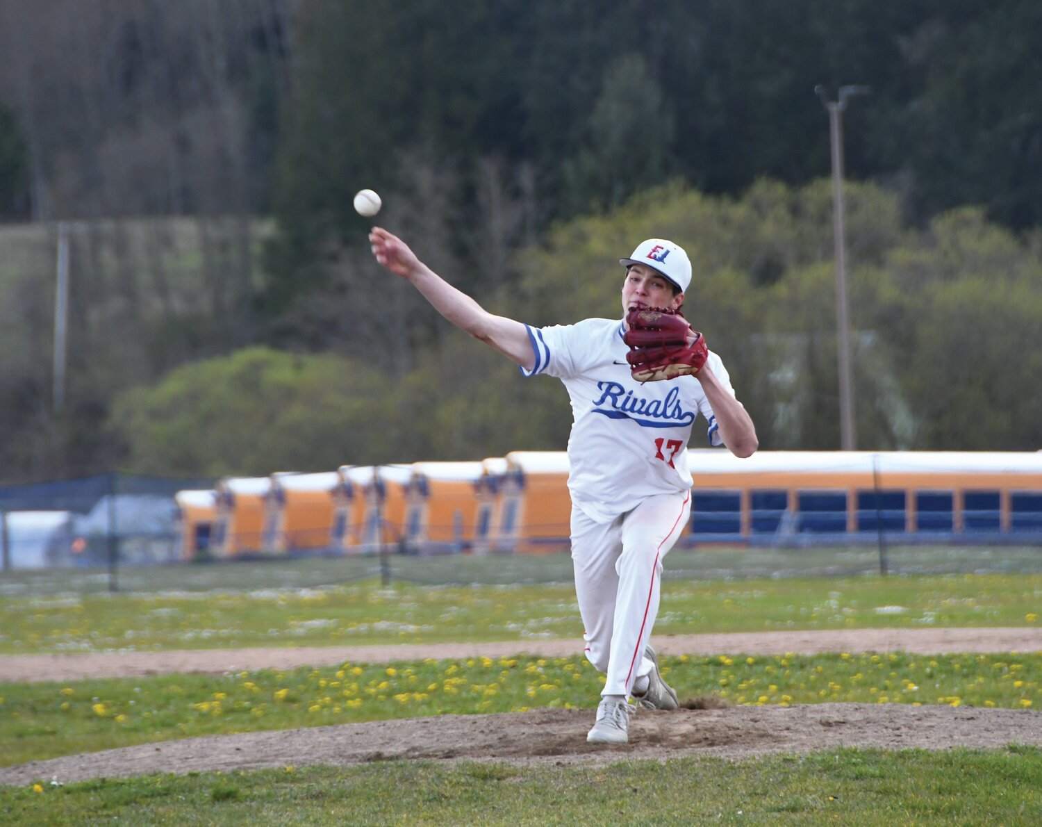 EJ senior Rhian Popp darts a pitch in the strike zone during the opening inning versus Bellevue Christian.